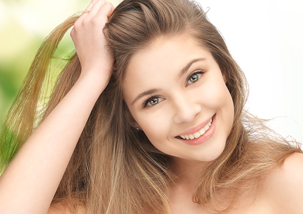 smiling girl with healthy hair and skin