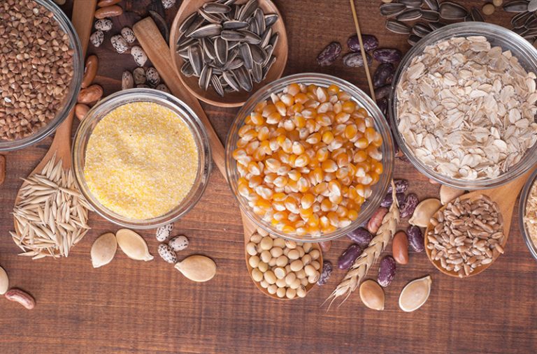 assortment of whole grains in small bowls