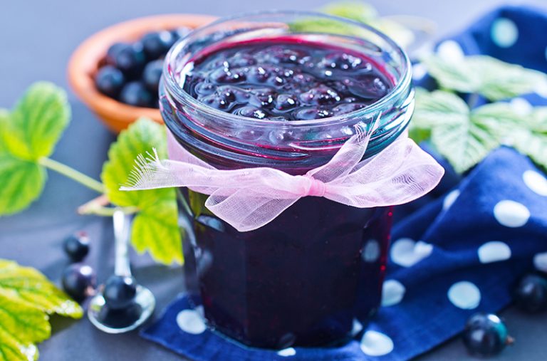 small mason jar of black currant jam