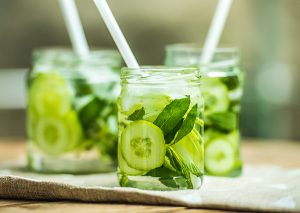 three jars of cucumber and mint infused water