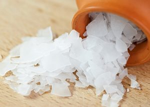 magnesium flakes spilling out of an orange bottle