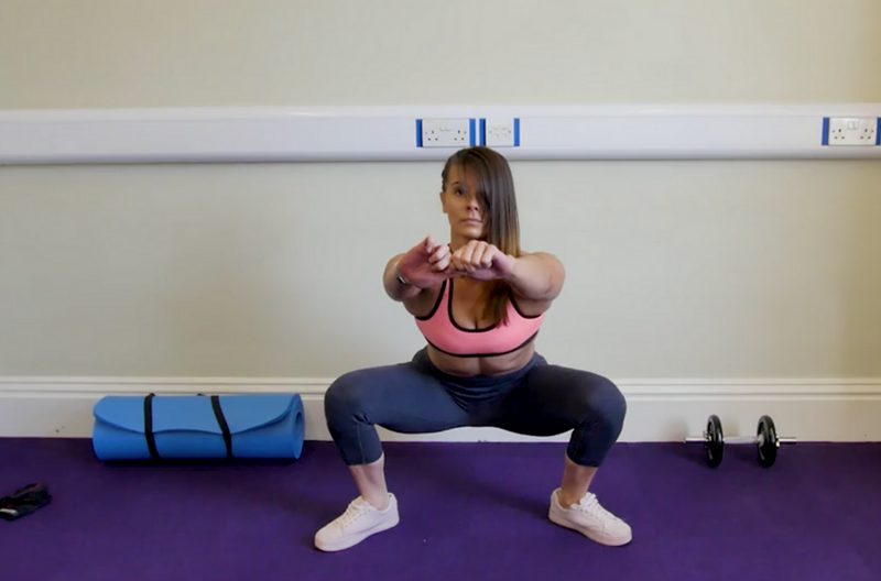 Woman doing bodyweight squat butt exercises