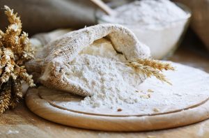 bag of cassava flour spilling onto a cutting board