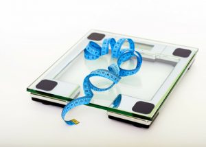 blue measuring tape on a glass scale