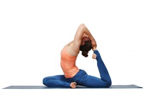 woman performing a yoga pose on a mat