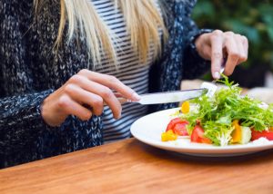 a woman having a salad