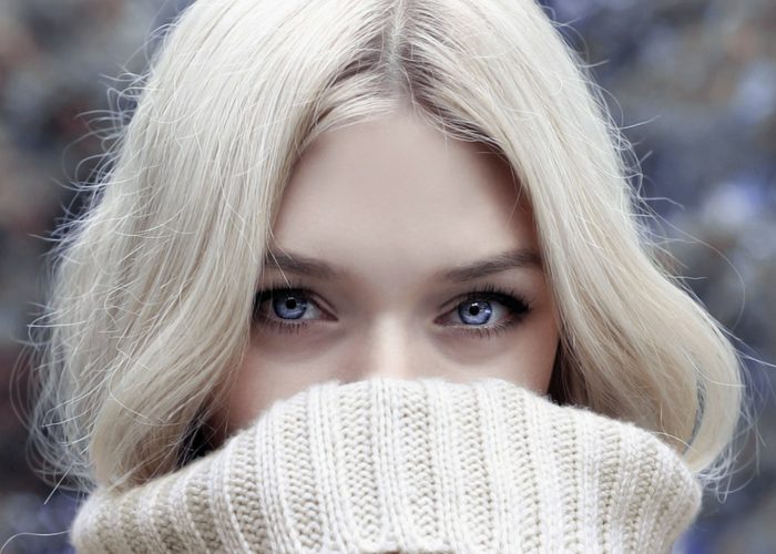 close up of beautiful blonde woman with blue eyes