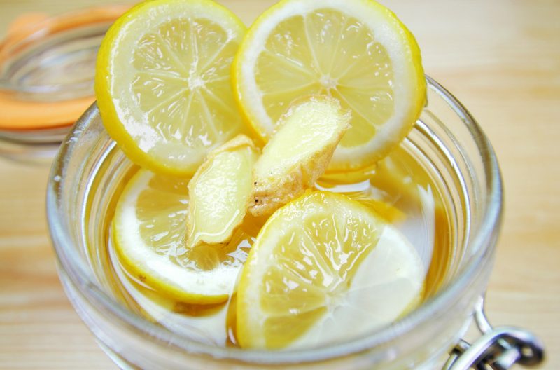 Lemon ginger honey mixture in mason jar for homemade lemon and ginger tea