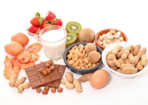 common allergy foods like milk, kiwi, eggs, nuts, strawberries, and prawns