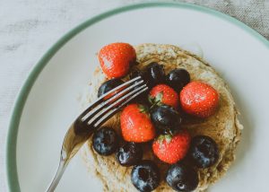 pancakes topped with alkaline diet foods like strawberries and blueberries