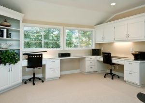 clean and spacious home office with white furniture