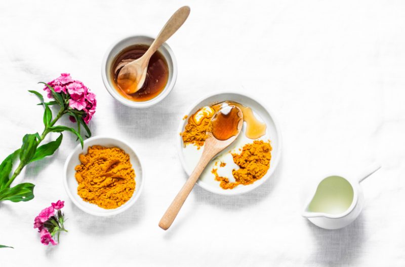 Natural face mask ingredients such as turmeric powder, honey and milk
