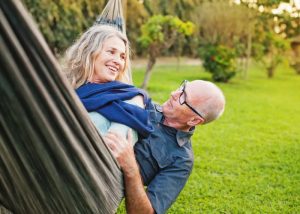 old couple relaxing in a hammock