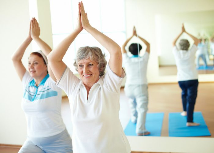 elderly women in a yoga class