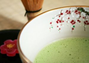 matcha green tea mixture in a floral bowl
