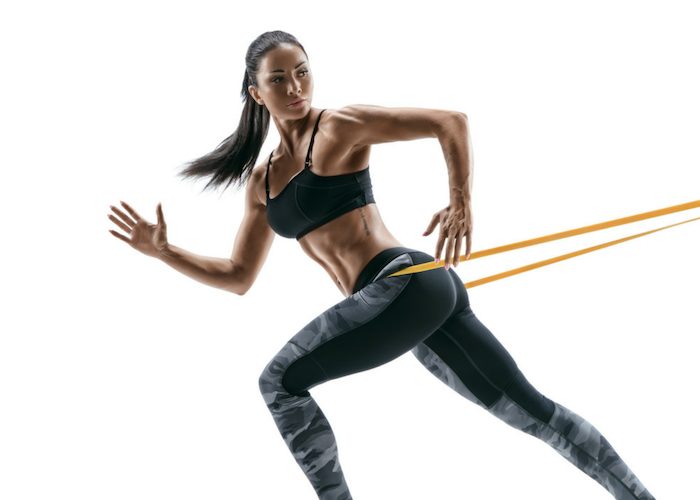woman doing resistance band training workout without the gym