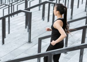 woman running down stairs outdoors having a workout without the gym