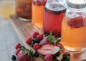 Homemade bottles of probiotic rich kombucha infused with fruits
