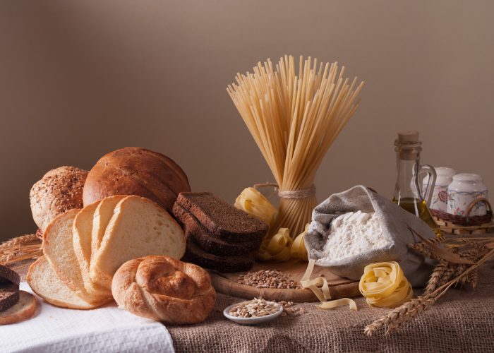 gluten foods such as pasta, grains, and breads on a table