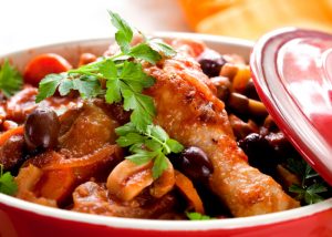 one pot meal of chicken, olives, and vegetables in a slow cooker