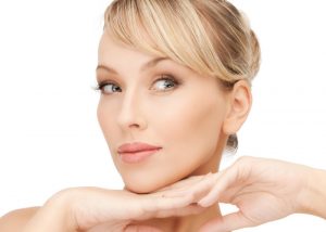 Woman's face with high cheekbones and a slim look after doing face yoga