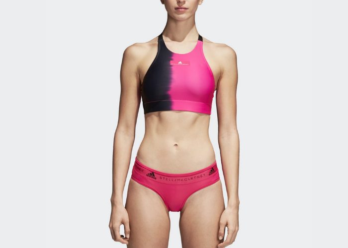 Athletic woman wearing pink and black Adidas by Stell McCatney sports bra bikini