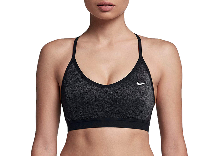 Woman wearing black colored Nike padded sports bra