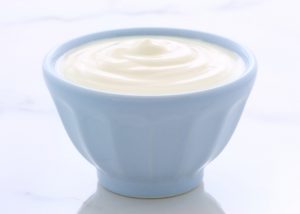 A light blue bowl filled with a large serving of DIY yogurt