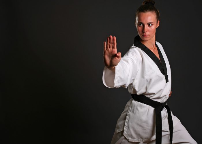 Female karate black belt in a karate pose