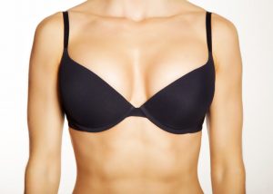 Focus on the torso of a woman wearing a black bra