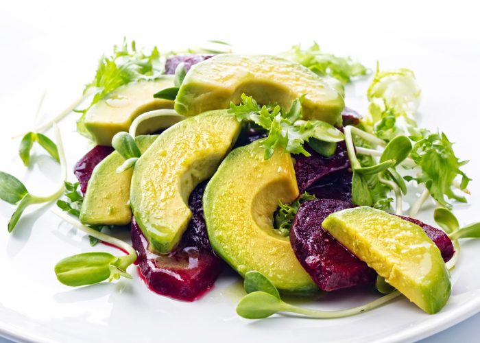 Plant-based meal of avocado, beetroot and sprouts salad