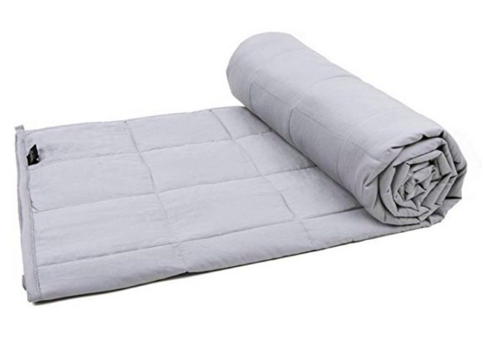 Light grey weighted blanket for adults half rolled up