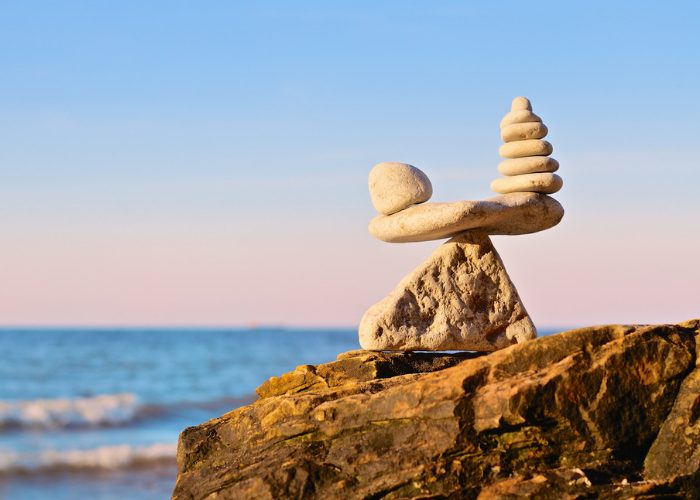 A structure of balancing rocks on a cliff by the seaside