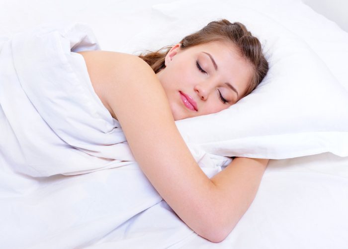 Woman sleeping restfully in bed
