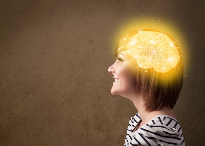Woman side profile with graphic of a shining brain on her head
