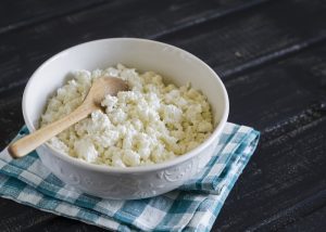 A bowl of cottage cheese on a teatowl