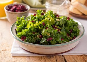 A bowl of fresh kale, an example of a bitter food