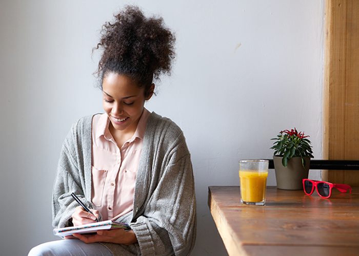 Woman journaling in her home