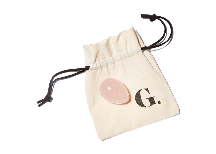 Goop pink yoni egg on a cotton string pouch with the Goop logo