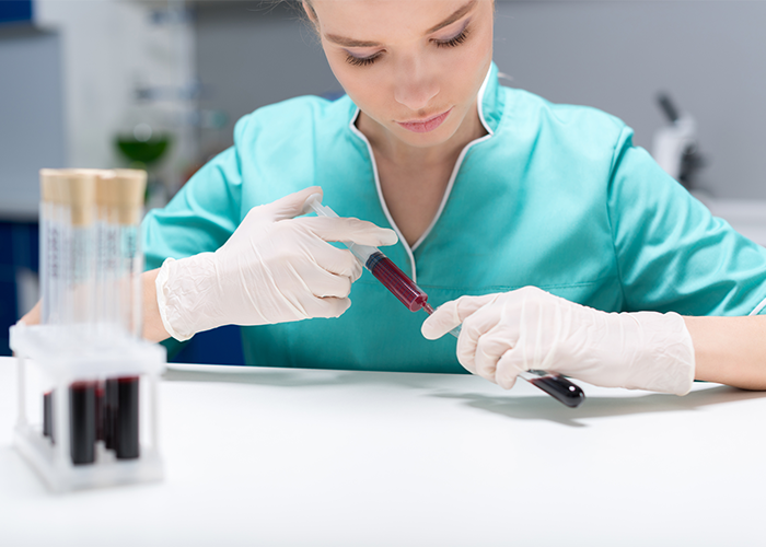 Female lab technician working with blood samples