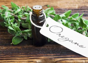 Bottle of oregano essential oil for use on skin tags