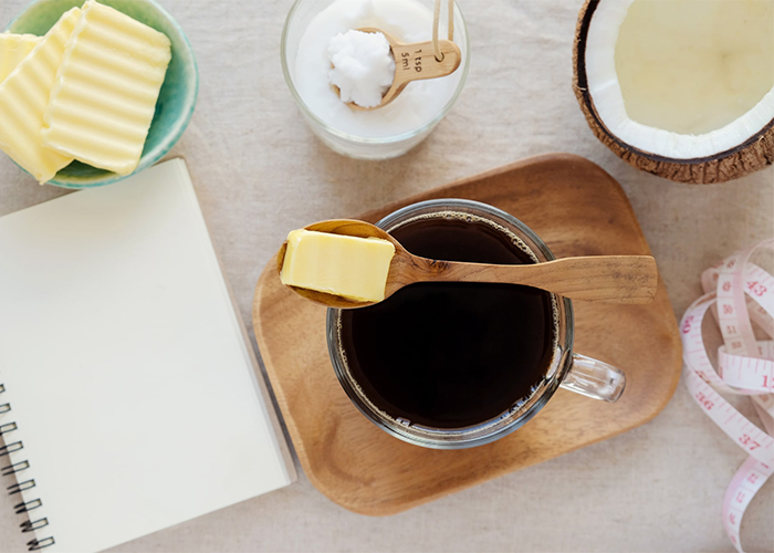 Top-down shot of keto diet foods and a recipe notebook