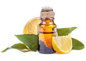 A bottle of lemon essential oil designed to dehydrate skin tags