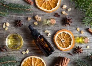 Flat lay featuring orange and anise essential oil blend