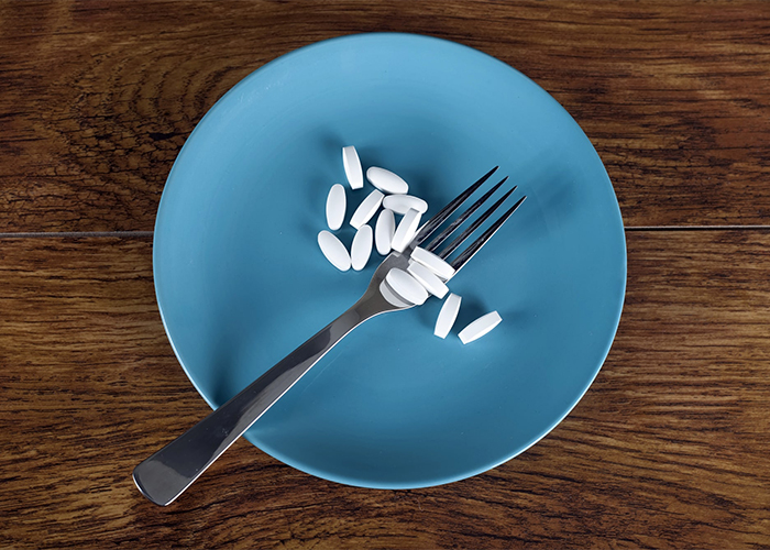 A plate filled with keto diet pills 