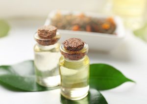 Tea tree essential oil bottles for skin tag removal