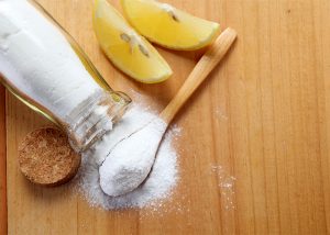 Ingredients for a homemade spot treatment with lemon essential oil.