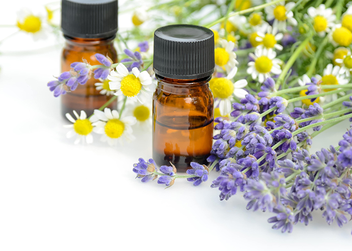 Bottle of Serenity essential oil blend with chamomile, lavender, and frankincense oils. 