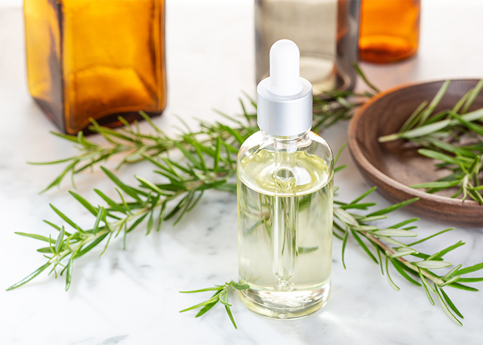 Bottle of Clarity essential oil blend with rosemary, sandalwood, and frankincense.