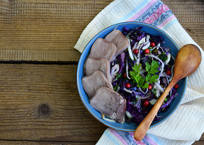 A salad of vegetables and meat that can be eaten on the AIP diet